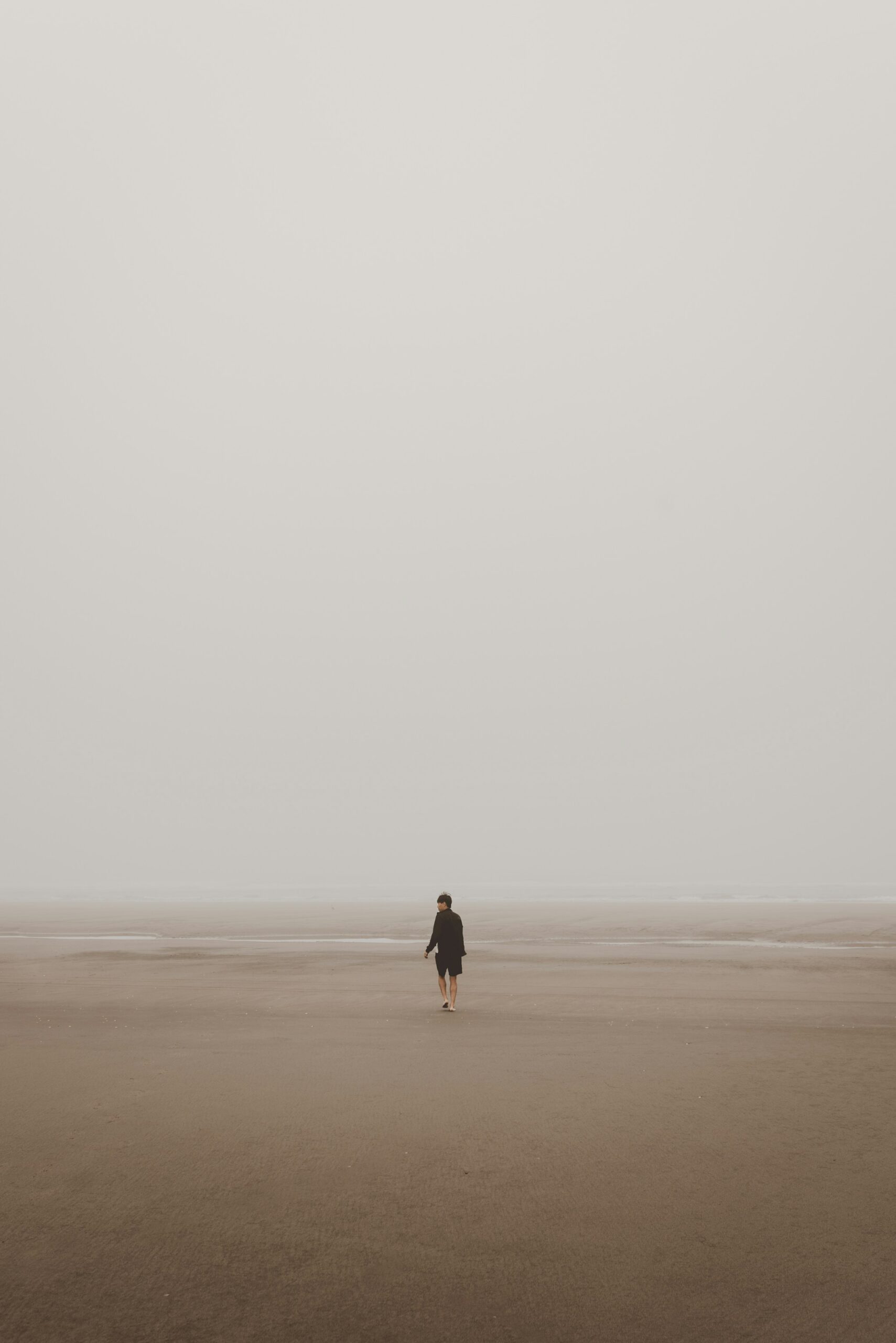 Person walking along a beach